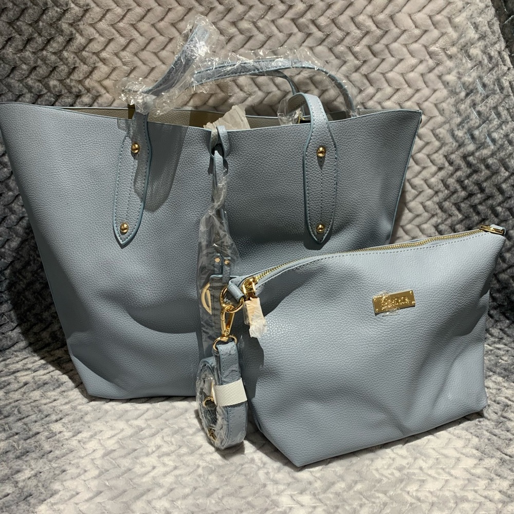 Reversible BEBE purse and make up bag.